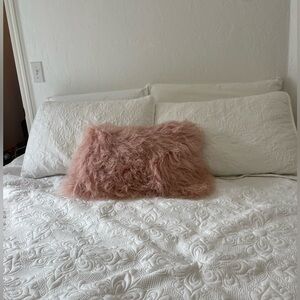 Fuzzy pink decorative pillow